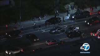 Crowd disperses as LAPD swoops in to break up Granada Hills street takeover | ABC7