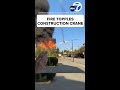 Fire topples construction crane