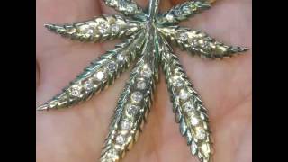 14k gold and diamond Marijuana leaf pendant