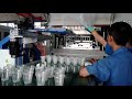 cup thermoforming machine with robot stacker