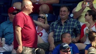 MIL@PHI: Phillies fans play hot potato with foul ball