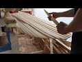 shaping a wooden surfboard