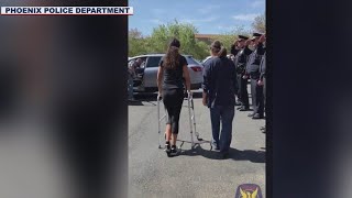 Phoenix police officer shot at gas station returns home