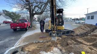 Cat 303.5 digging trench for new water line