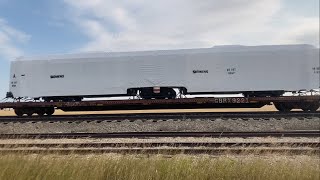 Siemens passenger car on a CPKC Freight train? CPKC 419 Heads into Vulcan, stops, and departs south!