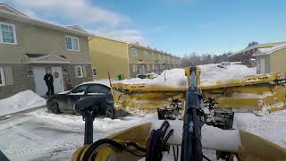 Clearing snow with a 908M  Cat with a 10-16 Metal Pless plow