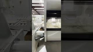 Painting doors white with our automated paint machine