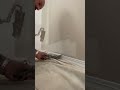 Cutting in paint to the baseboard tip