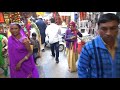 walking in india amongst 1000s of sai baba pilgrims looking around the shops near shirdi temple.....