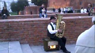 Fire-Spouting Tuba Player and Cute Baby in Warsaw, Poland