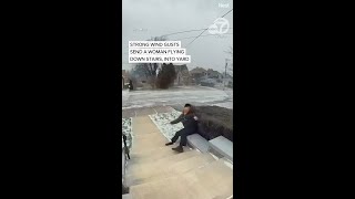 Strong wind gusts send a woman flying downstairs, into yard