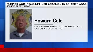 Former local police officer faces bribery, conspiracy charges
