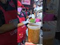 giant seafood dipping sauce famous grilled squid shop in bangkok thailand. streetfood shorts