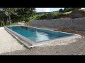 grey swimming pool with automatic cover made by macek a syn