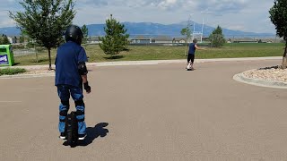 Friends helping friends learn to ride an Electric Unicycle.