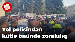 Yol polisindən kütlə önündə zorakılıq