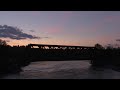 rocky mountaineer over the bridge at sunrise rmrx 8015 leads it west @ calgary ab