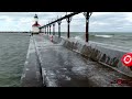 ice building up on michigan city lighthouse 4k drone footage