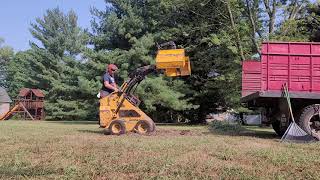 BMG grapple with clamshells cleaning up a dead pine tree.