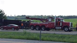 Illinois State Police and emergency crews tend to overturned tractor trailer truck on I-55 near Troy