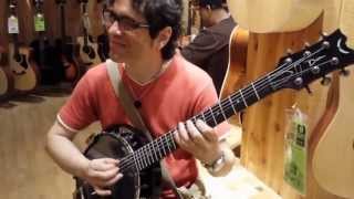 Luciano Magno - Testing a Banjo Guitar at Guitar Center Store