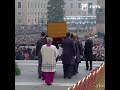 Pope Benedict XVI's coffin is carried to St. Peter’s Square at the Vatican