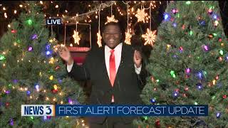 Meteorologist Chris Reece celebrates this morning's snow