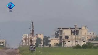 Video of a Syrian regime helicopter dropping a barrel bomb on the small town of Kafr Nabudah