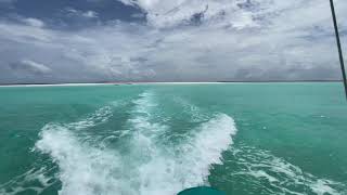 Boat ride from the famous Soneva Fushi Maldives sandbar back to the hotel, passing Soneva Aqua yacht