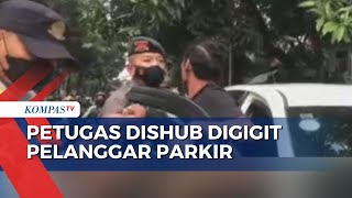 Momen Petugas Dishub Digigit Pelanggar Lalin yang Parkir di Jalur Sepeda