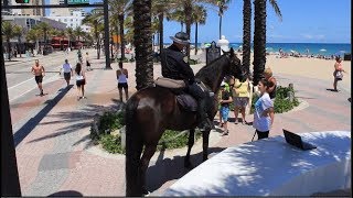 Horse Mounted Police Officer Patrolling Las Olas near A1A in Fort Lauderdale, Florida