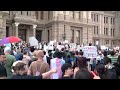 watch live protesters march in texas capital against project 2025