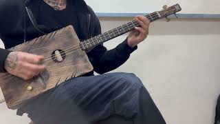 Cigar box guitar 3 strings western music movie song