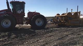 A pair of TOOMEY 4500C Scrapers and STX500's lowering an old roadway.