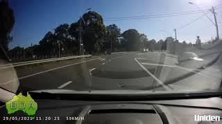 BAD Driving Australia - Truck driver goes around queue of cars at lights and to wrong side of road