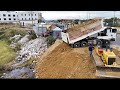 Awesome bulldozer start new project with dump trucks