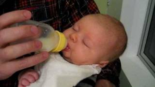 Daddy bottle feeding Liam