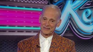 Filmmaker John Waters encourages college graduates to ‘make trouble’