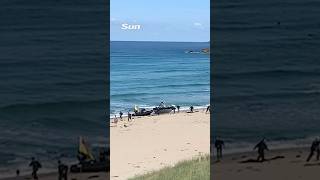 Shocking moment drugs gang are chased onto popular UK beach in front of stunned sunbathers