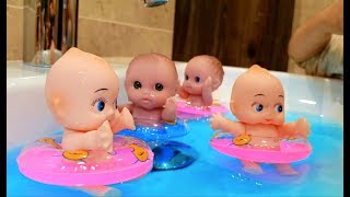 baby dolls swimming in the sink