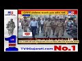 crpf police officials held a flag march in porbandar to spread awareness about law u0026 order tv9news