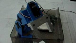 Low Cost DIY Robotic Arm with Gripper and Basic Stamp