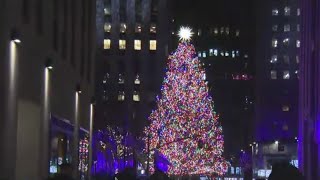 Rockefeller Center tree lit up by 50,000 sparkling lights