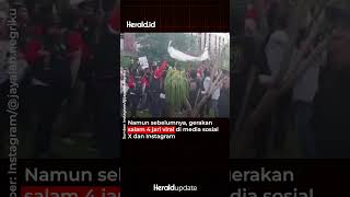 Momen Pendukung AMIN Salam 4 Jari ke Massa Ganjar-Mahfud Sebelum Debat Capres