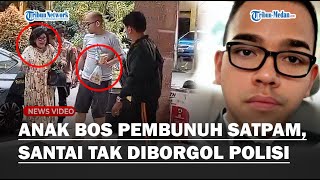 GAYA SANTAI Anak Pengacara Pembunuh Satpam Tenteng Gorengan ke Kantor Polisi : Tak Diborgol