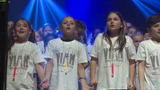 5,000 children sing the John Legend classic 'All of Me'