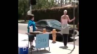 Funny cheeky kid trying to sell beer