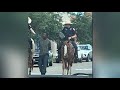 video mounted police cuff man with rope