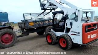 Bobcat SSL with Pallet fork attachment