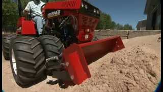 Steiner 440 Tractor with Slip Scoop Attachment